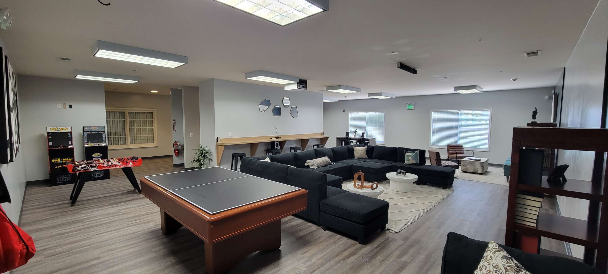 a room with a large couch and pool table